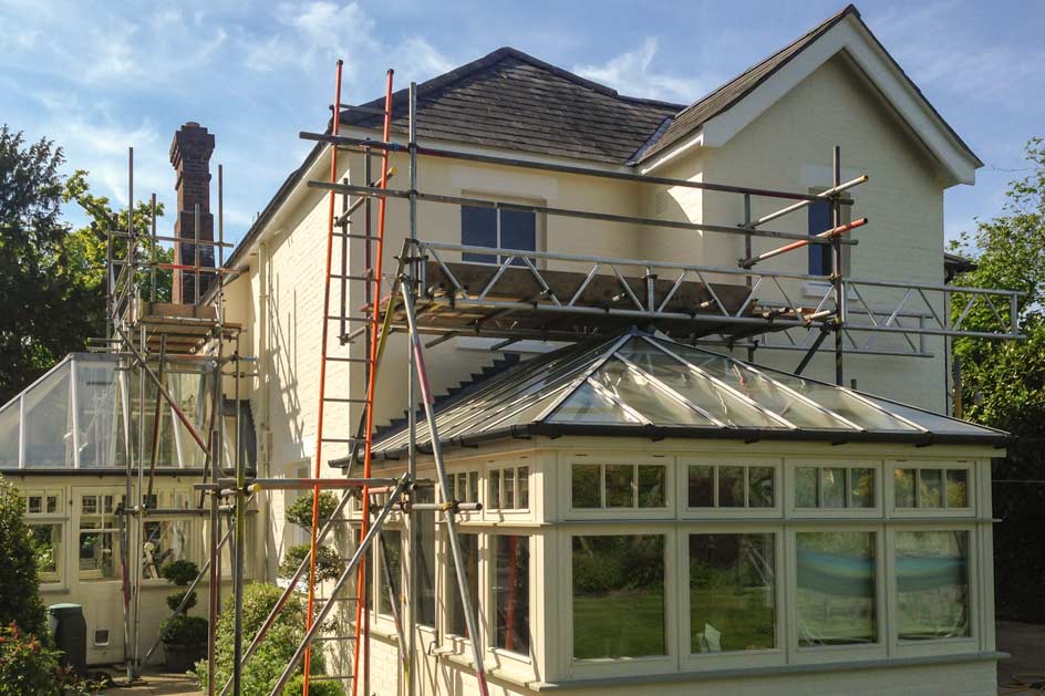 Paramount Scaffolding Solutions - Assembling a skybridge over a glass roof in Brockenhurst